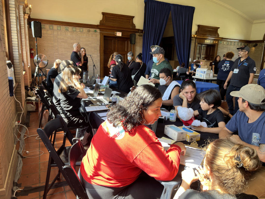 Image of people meeting with Catholic Charities representatives