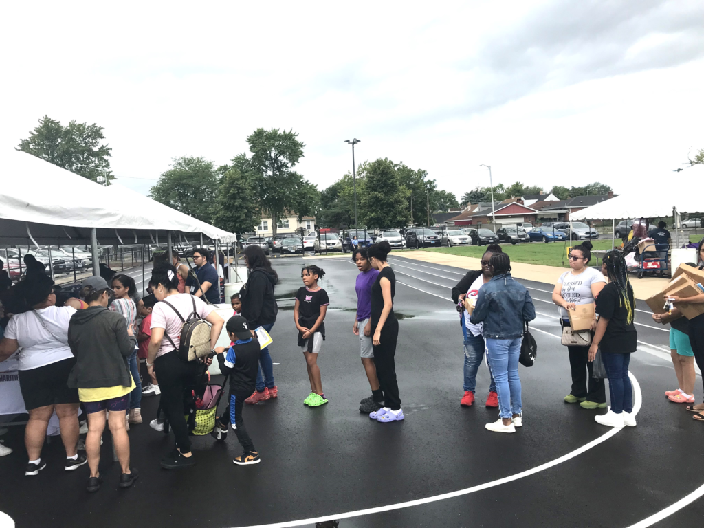 People in line for backpacks