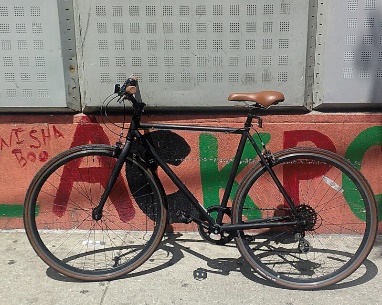 Bicycle standing in front of wall