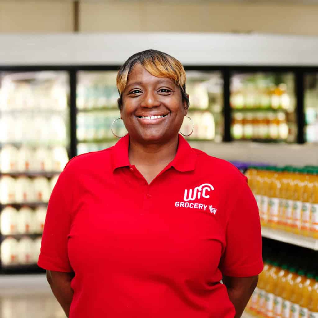 Woman smiling at WIC grocery store