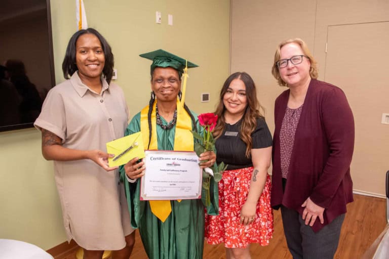 Family Self Sufficiency Program graduate Brenda Jackson group photo at graduation