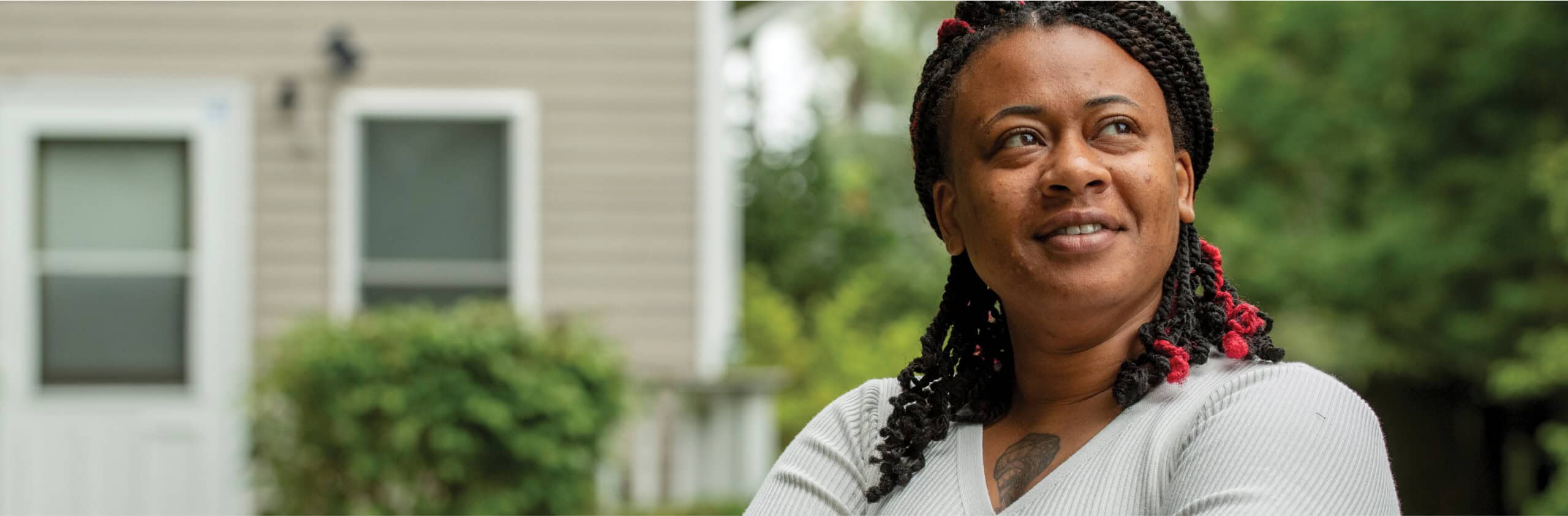 Woman smiling looking off into the distance