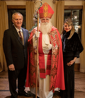 People posing with Saint Nicholas