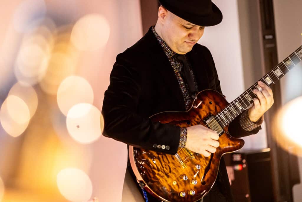 Man Playing guitar at 2026 D'Vine Affair