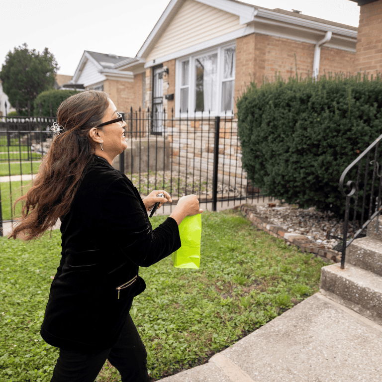Sophia Ortiz visiting a home with a gift